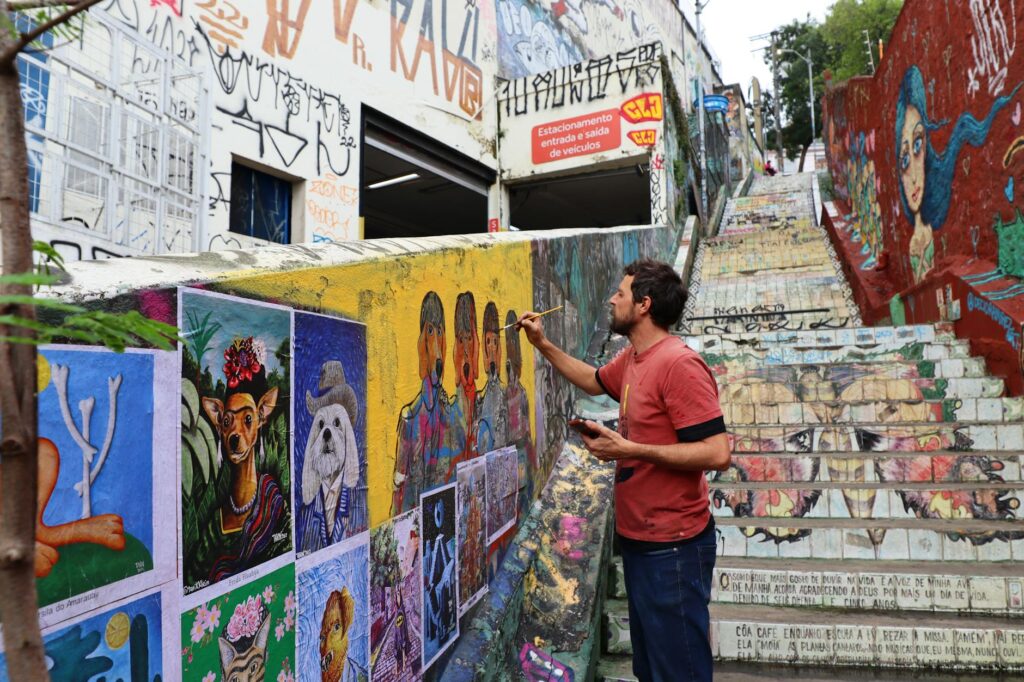 street artist painting vibrant urban wall mural
